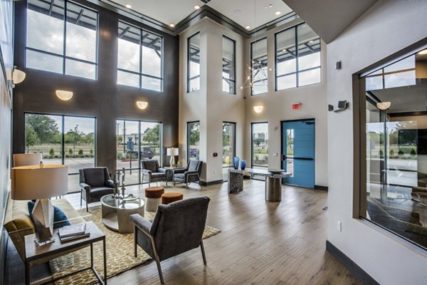 Modern clubhouse with sleek design elements at Quest Apartments, offering luxury amenities for residents