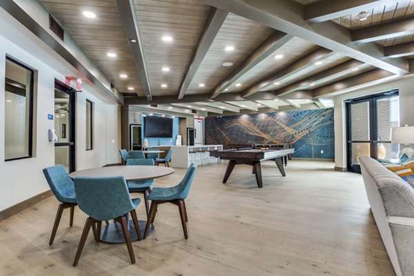 Clubhouse featuring modern decor and seating at Quest Apartments