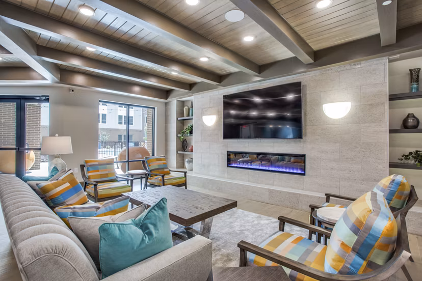 Clubhouse with modern seating and open spaces at Quest Apartments