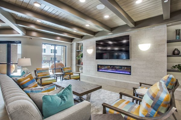Clubhouse with modern seating and open spaces at Quest Apartments