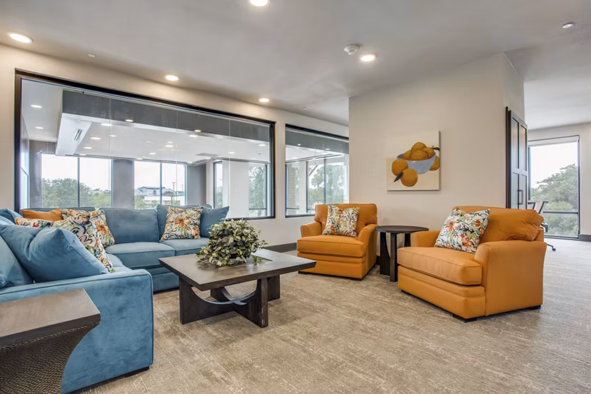 Clubhouse with modern design and communal seating at Quest Apartments, a luxury Greystar community
