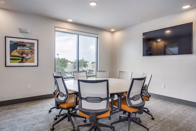 Modern meeting facility with state-of-the-art technology at Quest Apartments, ideal for business gatherings and events