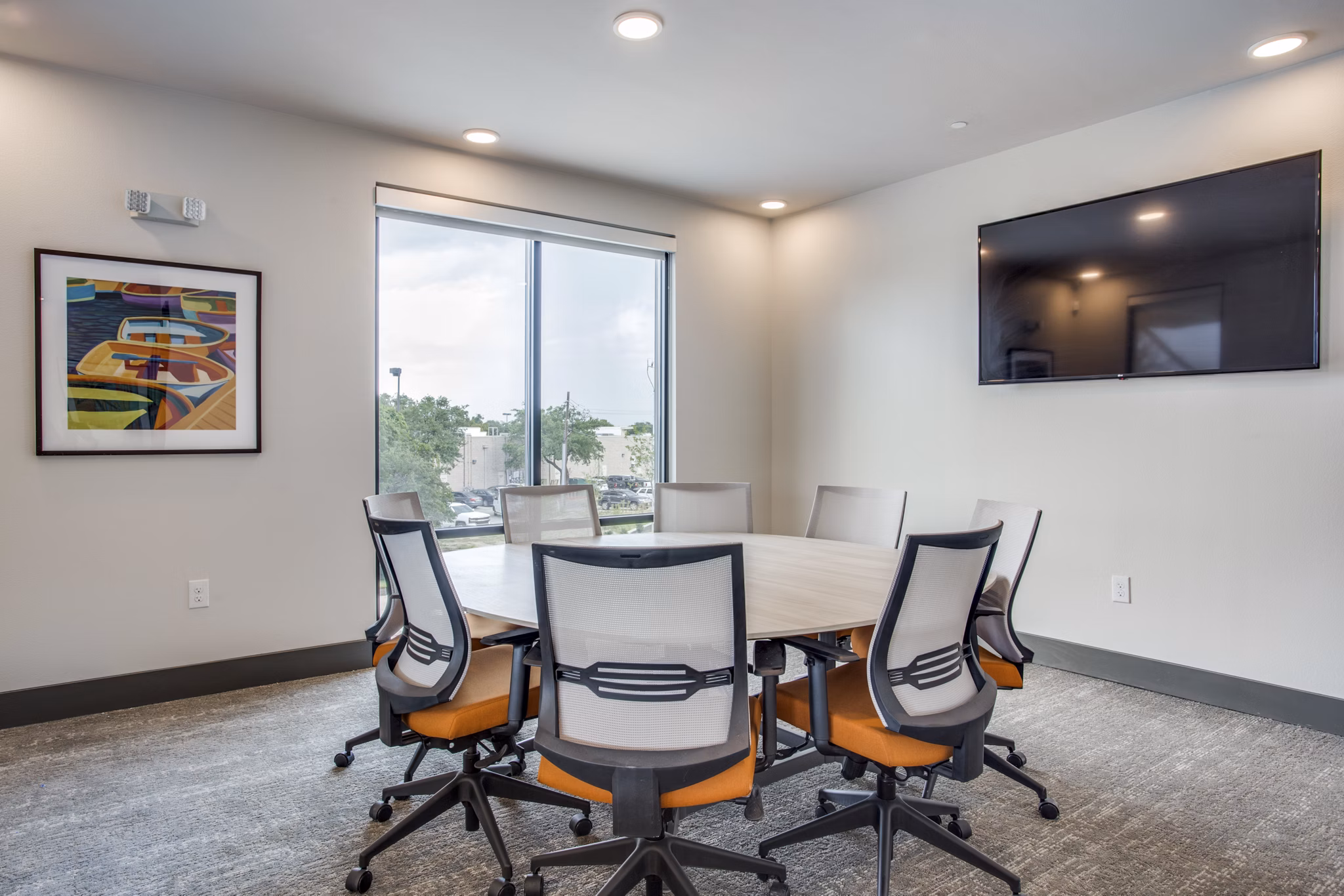 Modern meeting facility with state-of-the-art technology at Quest Apartments, ideal for business gatherings and events