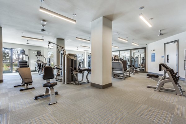 Spacious fitness center with modern equipment at Quest Apartments