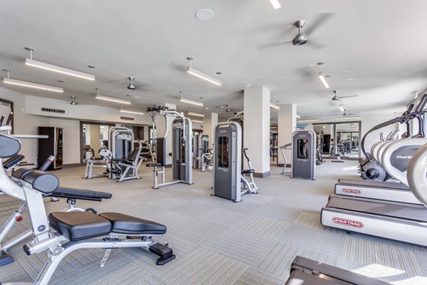 State-of-the-art fitness center at Quest Apartments with modern exercise equipment and spacious workout areas