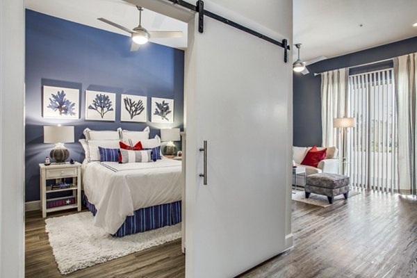 Spacious dining area with modern furnishings at Quest Apartments