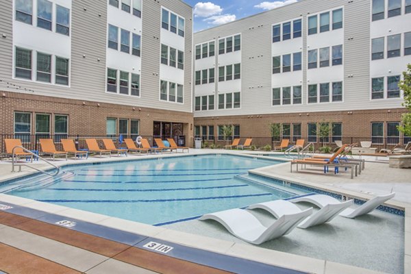 Luxurious pool surrounded by scenic views at Quest Apartments