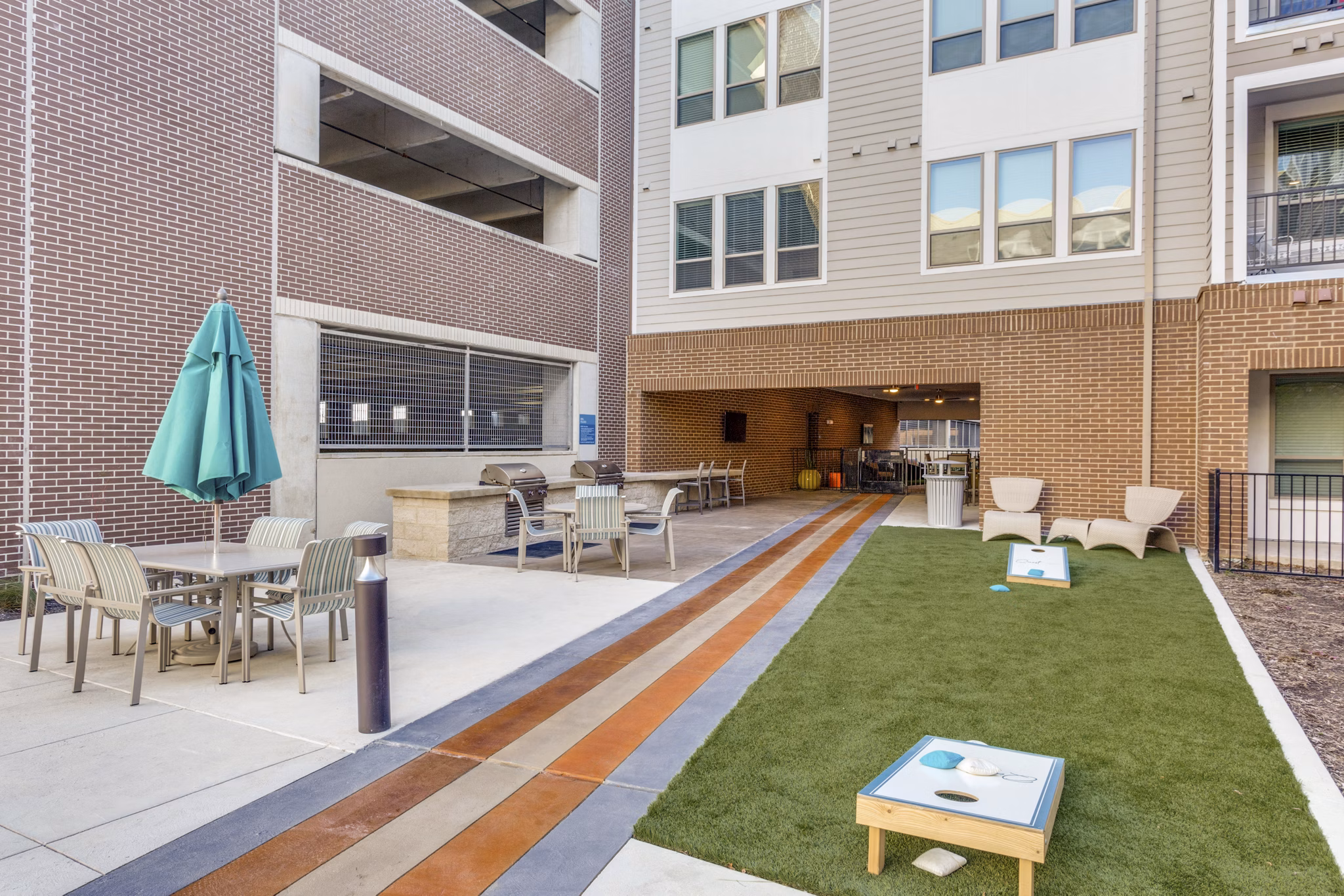 Courtyard with lush landscaping at Quest Apartments, a Greystar luxury living community