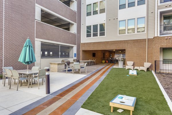Courtyard with lush landscaping at Quest Apartments, a Greystar luxury living community