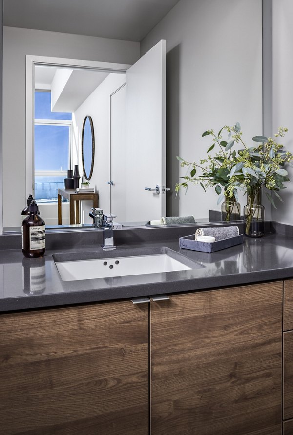 Bathroom with modern fixtures and marble vanity in Diega Apartments, luxury living in San Diego