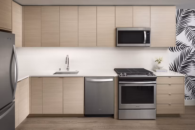Modern kitchen featuring sleek cabinetry and stainless steel appliances at Diega Apartments, Greystar luxury property in downtown San Diego