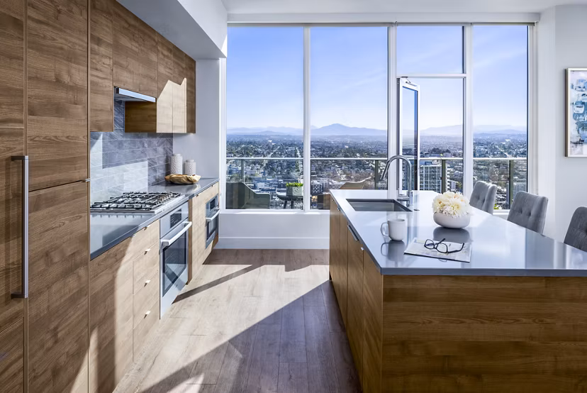 Modern kitchen with stainless steel appliances at Diega Apartments, a Greystar luxury property in vibrant San Diego