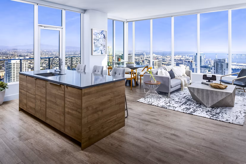 Diega Apartments: Open-concept dining and living room with modern decor and large windows in San Diego luxury apartments