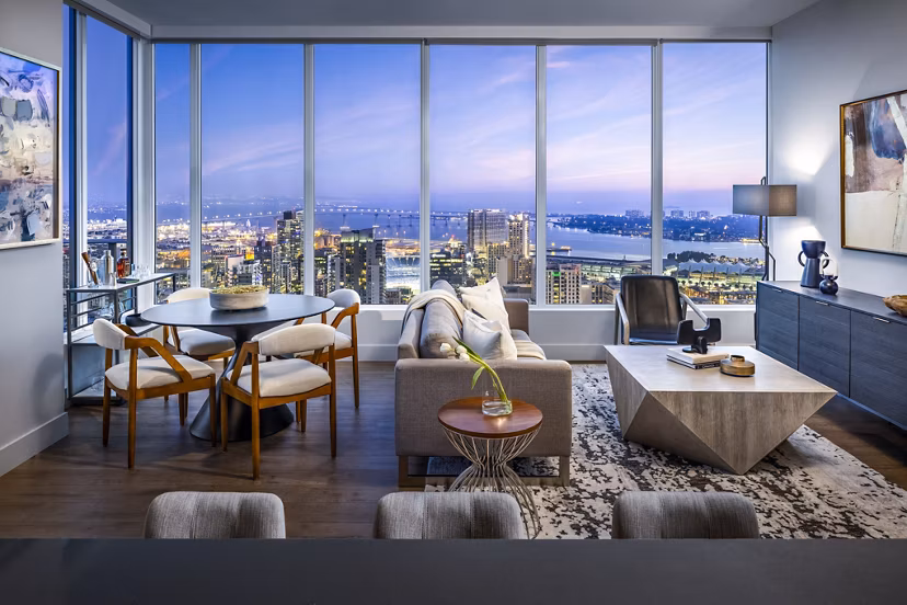 Diega Apartments: Contemporary dining and living room with stylish decor and open layout in luxury high-rise rental property