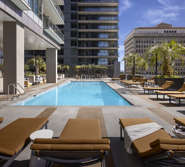 Poolside relaxation area with modern seating at Diega Apartments, a luxury community by Greystar in the heart of San Diego
