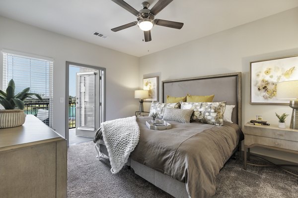 bedroom at Arista Riverstone Apartments