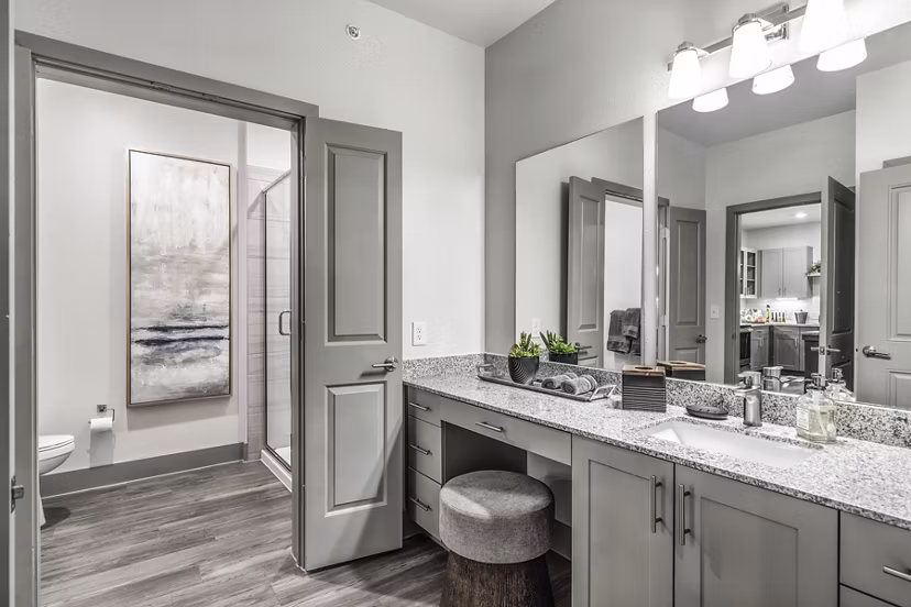 Modern bathroom featuring sleek fixtures and marble countertops at Arista Riverstone Apartments, luxury living spaces by Greystar