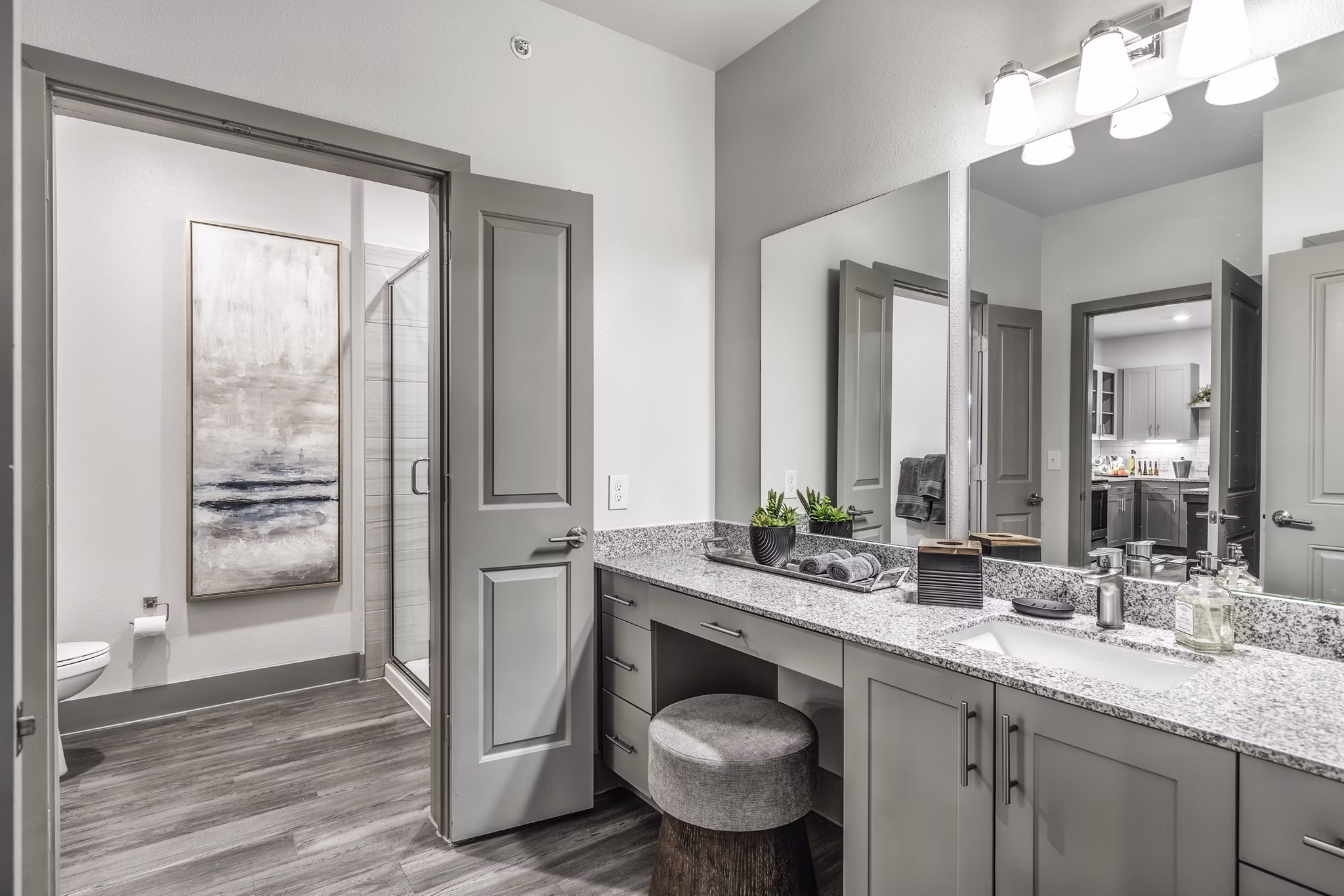Modern bathroom featuring sleek fixtures and marble countertops at Arista Riverstone Apartments, luxury living spaces by Greystar