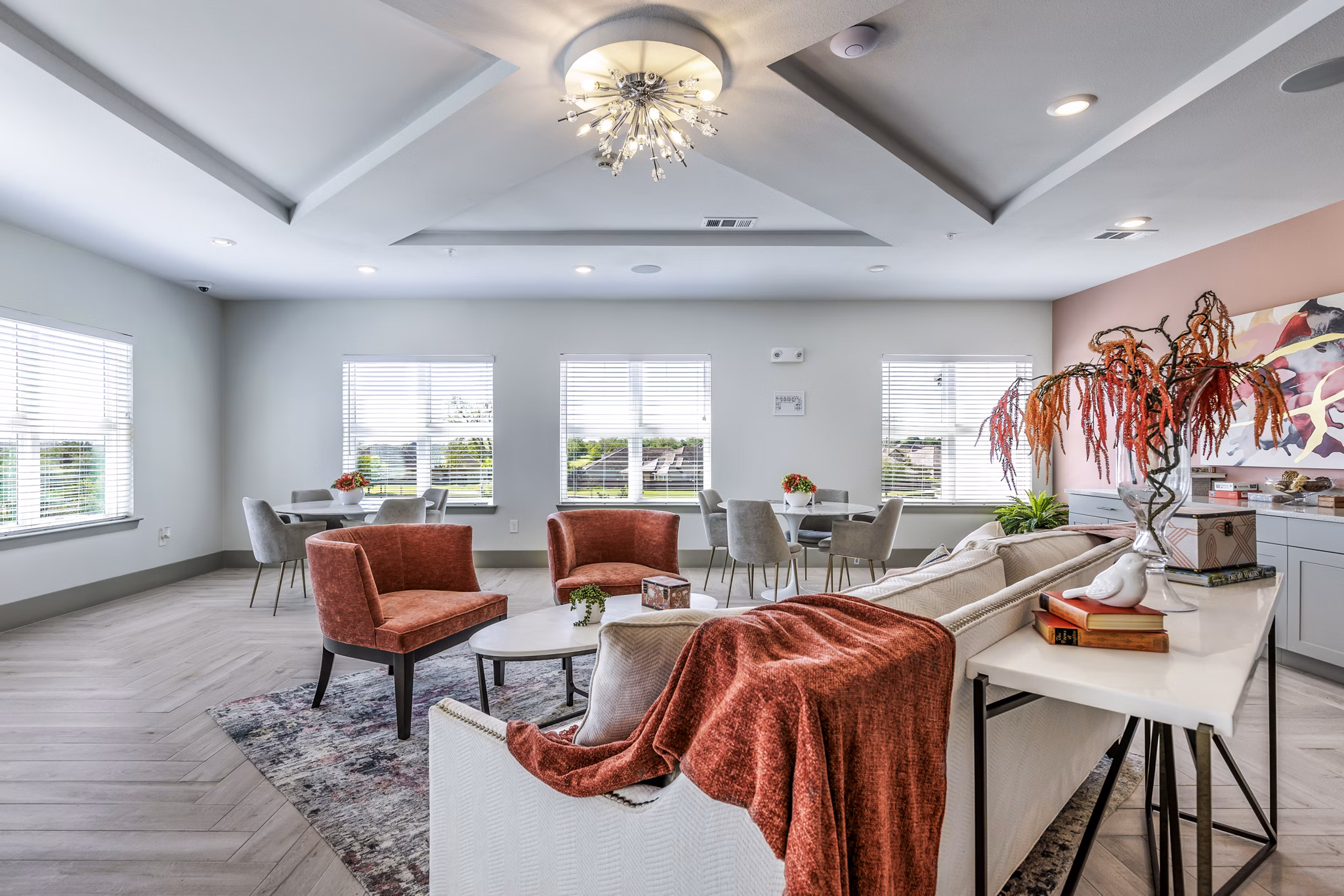 Clubhouse with modern design and cozy seating at Arista Riverstone Apartments