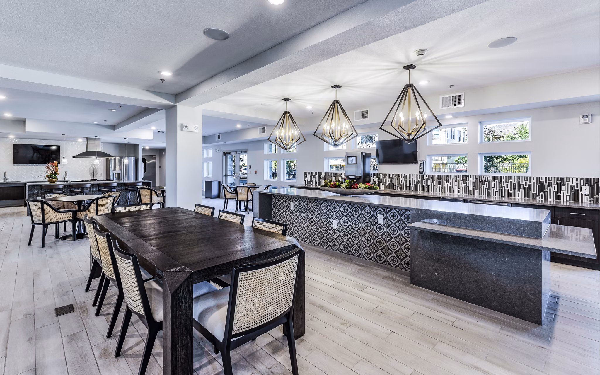 Modern clubhouse with communal seating at Arista Riverstone Apartments