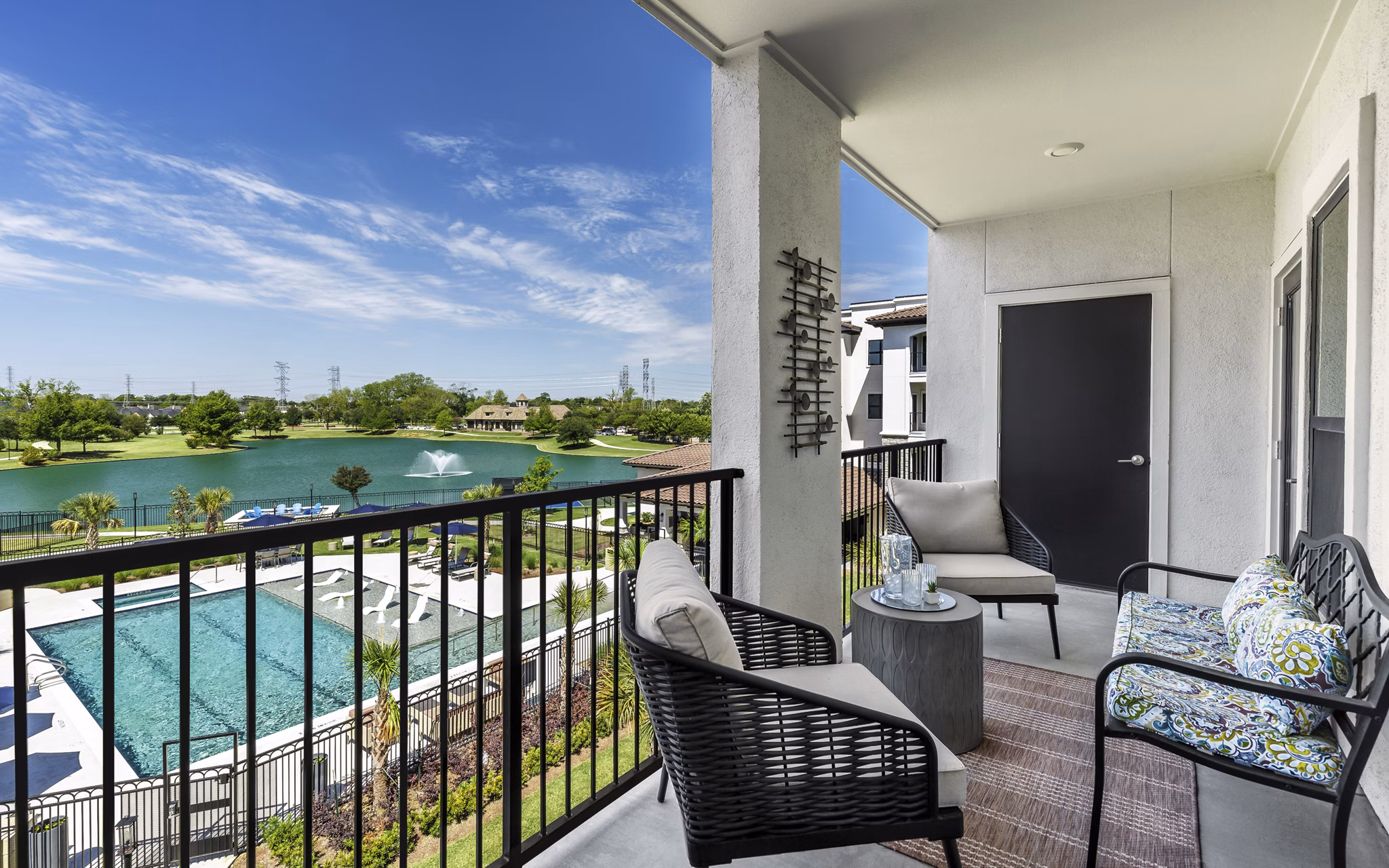 Outdoor patio with modern seating at Arista Riverstone Apartments