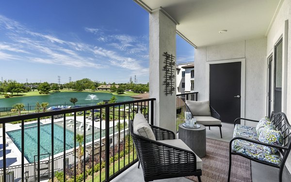 Outdoor patio with modern seating at Arista Riverstone Apartments