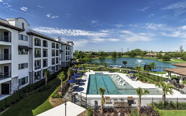 Arista Riverstone Apartments: Scenic view at luxury apartments featuring a lush garden courtyard in vibrant neighborhood