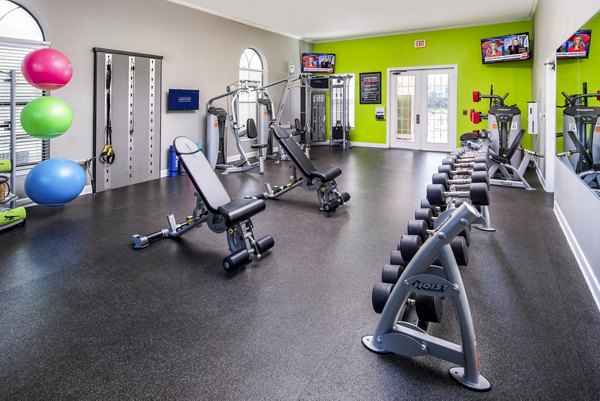 State-of-the-art fitness center with modern equipment at The Lofts Apartments for residents' wellness and exercise needs