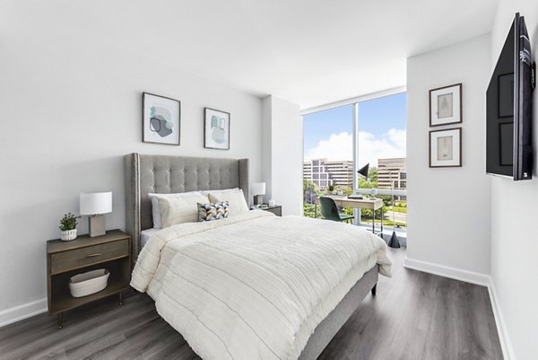 Cozy bedroom with natural light and modern decor at Atlantic Station West Apartments
