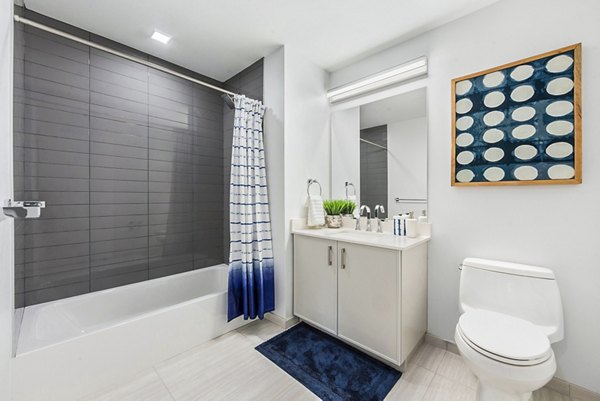 Atlantic Station West: Modern bathroom with sleek countertops and elegant fixtures