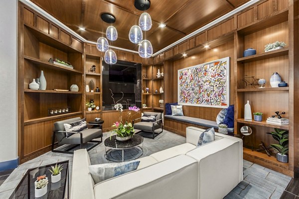 Clubhouse at Atlantic Station West Apartments: Modern space for community gatherings and relaxation with stylish seating and large windows
