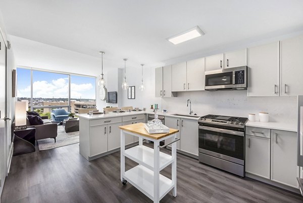 Atlantic Station West Apartments: Modern kitchen with stainless steel appliances and sleek counters