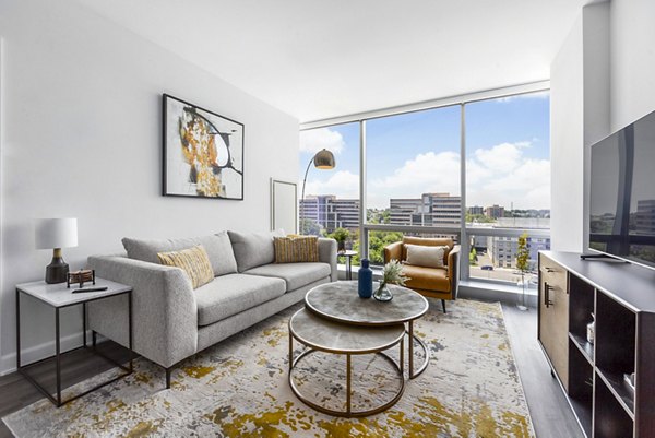 Comfortable living room with stylish decor at Atlantic Station West Apartments, perfect for relaxing in luxury