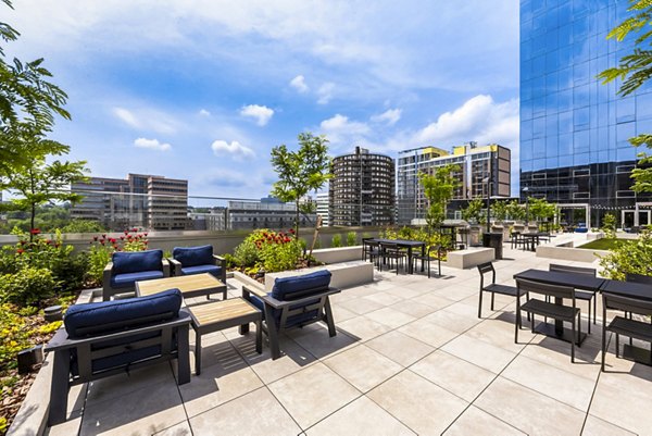 Cozy patio with outdoor seating at Atlantic Station West Apartments, an inviting space for relaxation in this luxury community