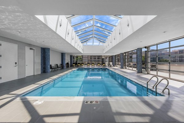 Atlantic Station West Apartments: Modern pool with lounging areas for residents