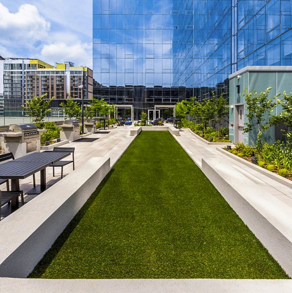 Sport court at Atlantic Station West Apartments: Outdoor basketball and tennis courts for active residents
