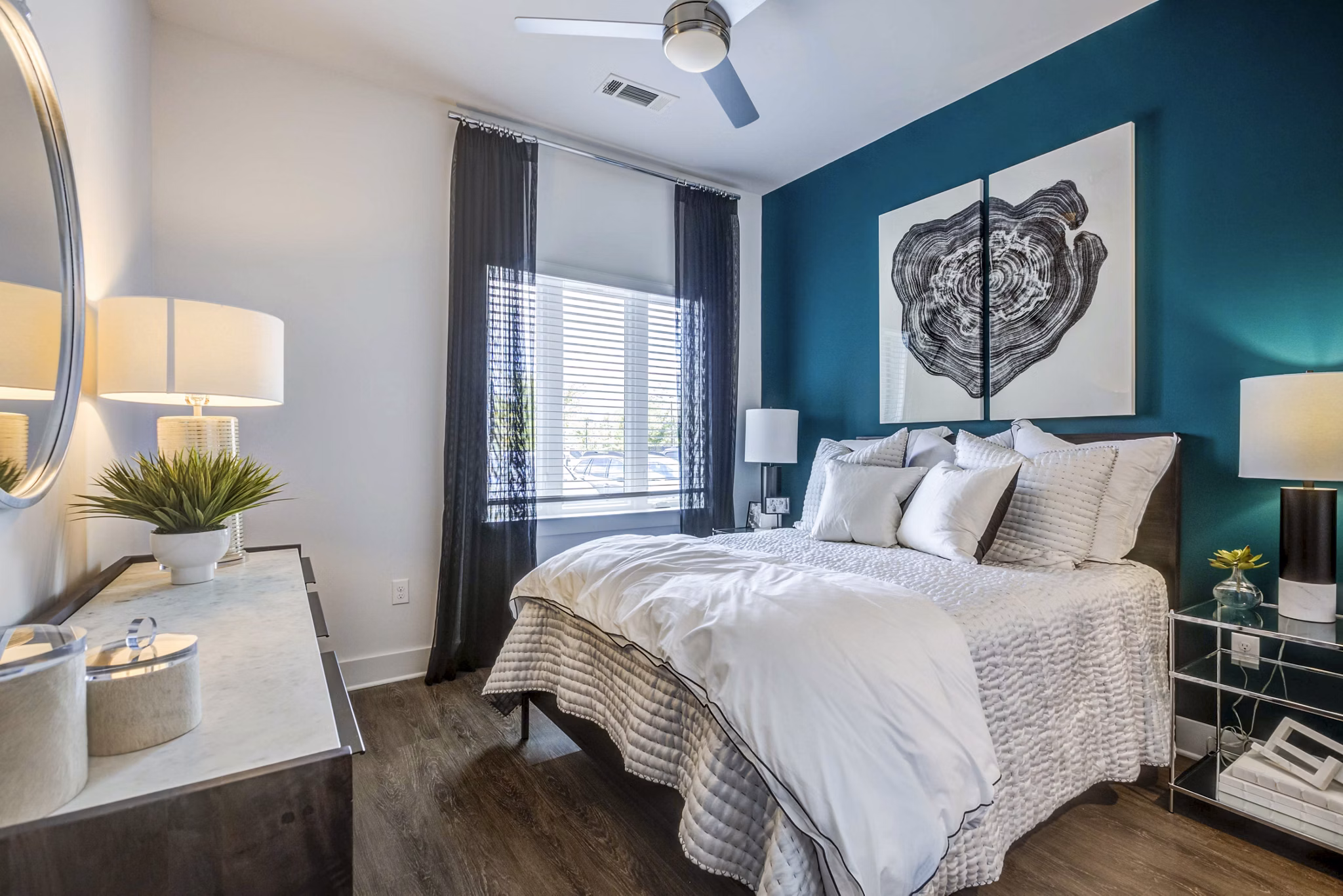 Spacious bedroom with modern furnishings at Candour House Apartments