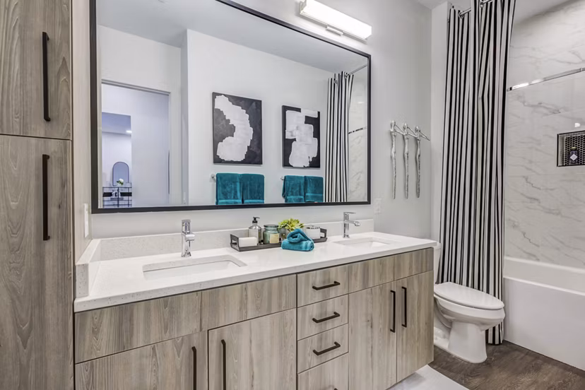 Candour House Apartments: Modern bathroom featuring sleek fixtures and elegant tiling