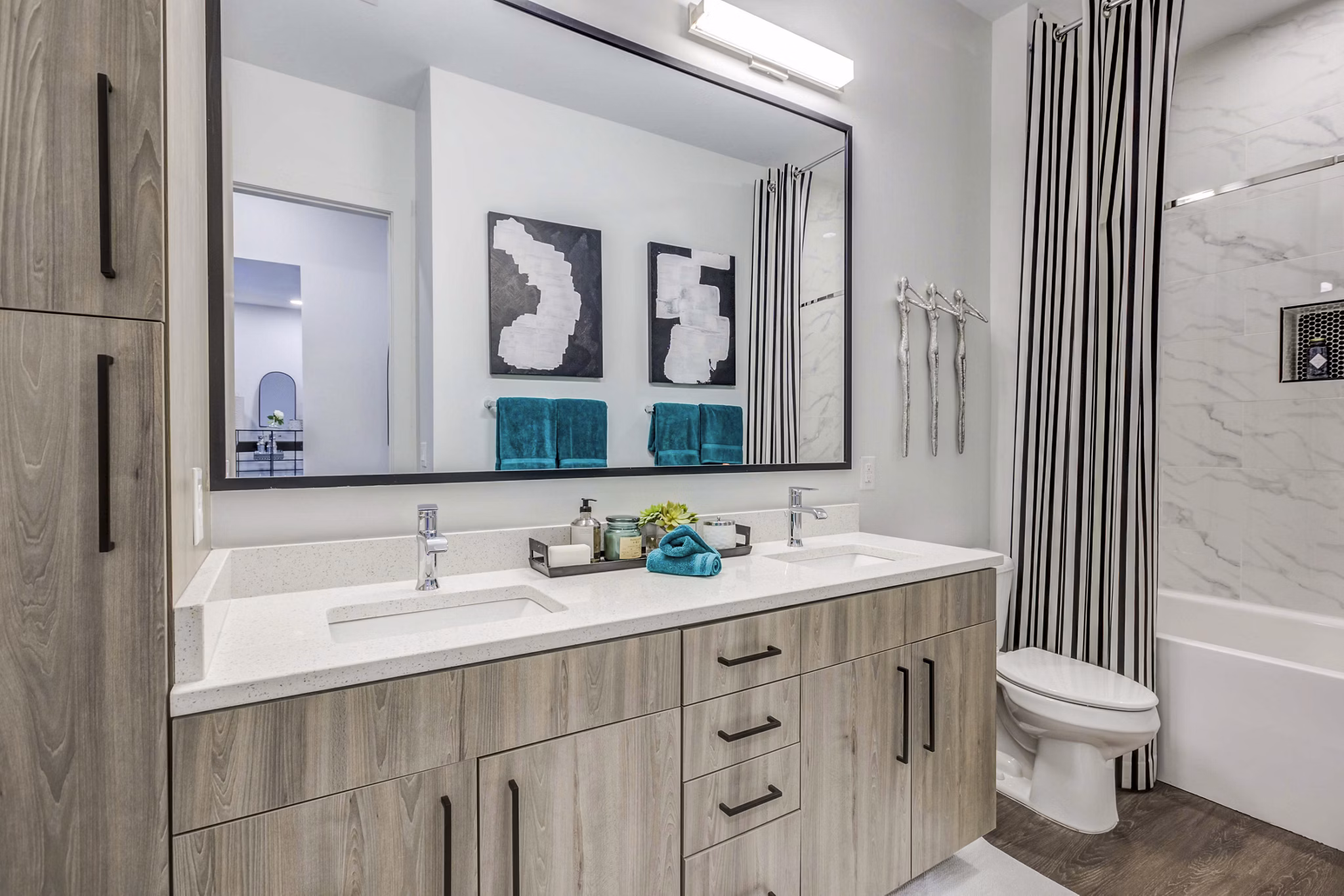 Candour House Apartments: Modern bathroom featuring sleek fixtures and elegant tiling