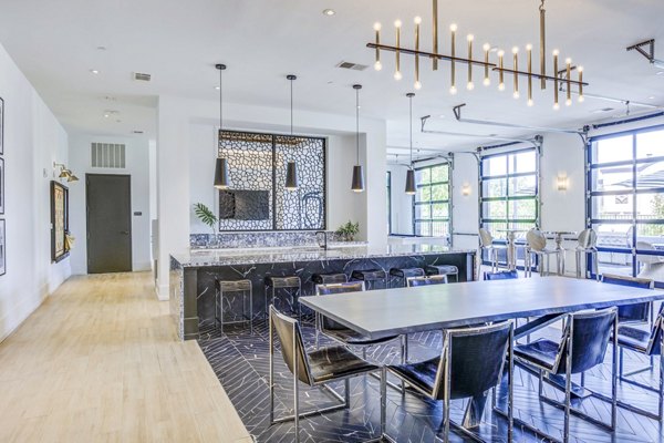 Candour House Apartments: Modern clubhouse featuring stylish interior design and cozy seating areas