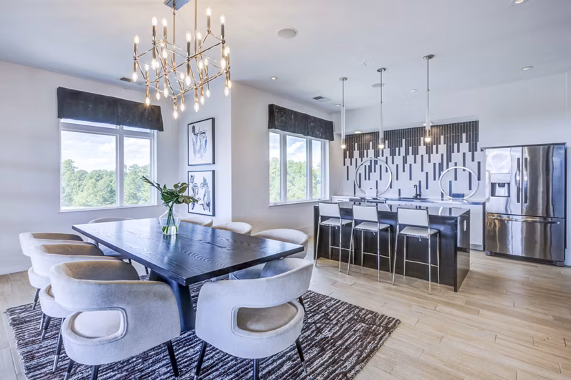Clubhouse at Candour House Apartments: Modern lounge area featuring stylish seating and high ceilings in luxury Greystar community