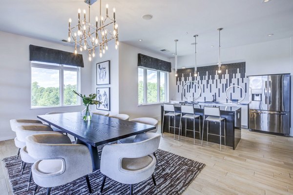 Clubhouse at Candour House Apartments: Modern lounge area featuring stylish seating and high ceilings in luxury Greystar community