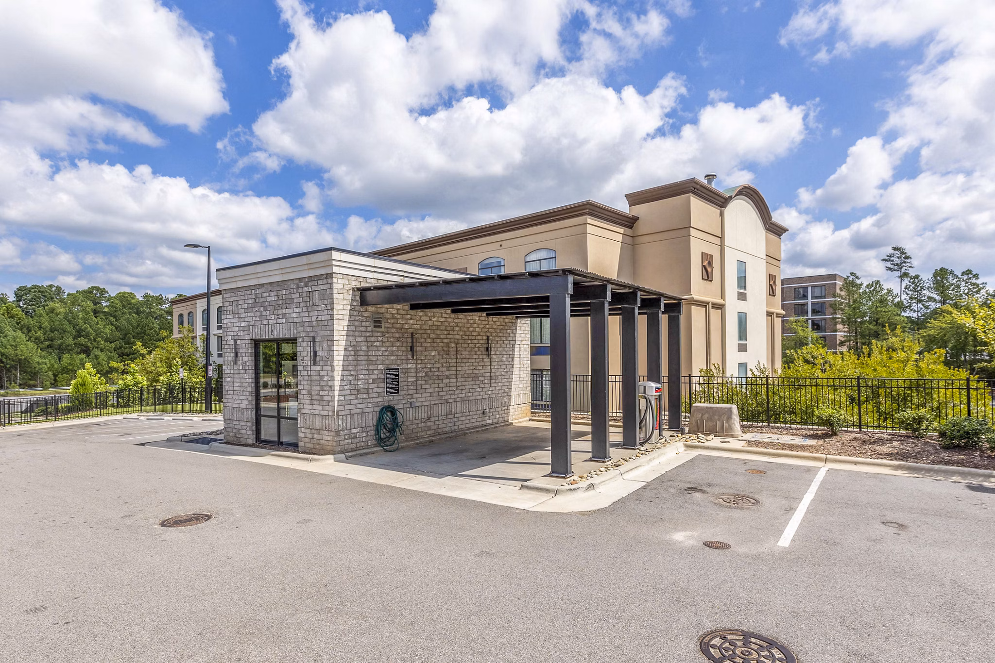 Car care station amenities at Candour House Apartments for convenient vehicle maintenance