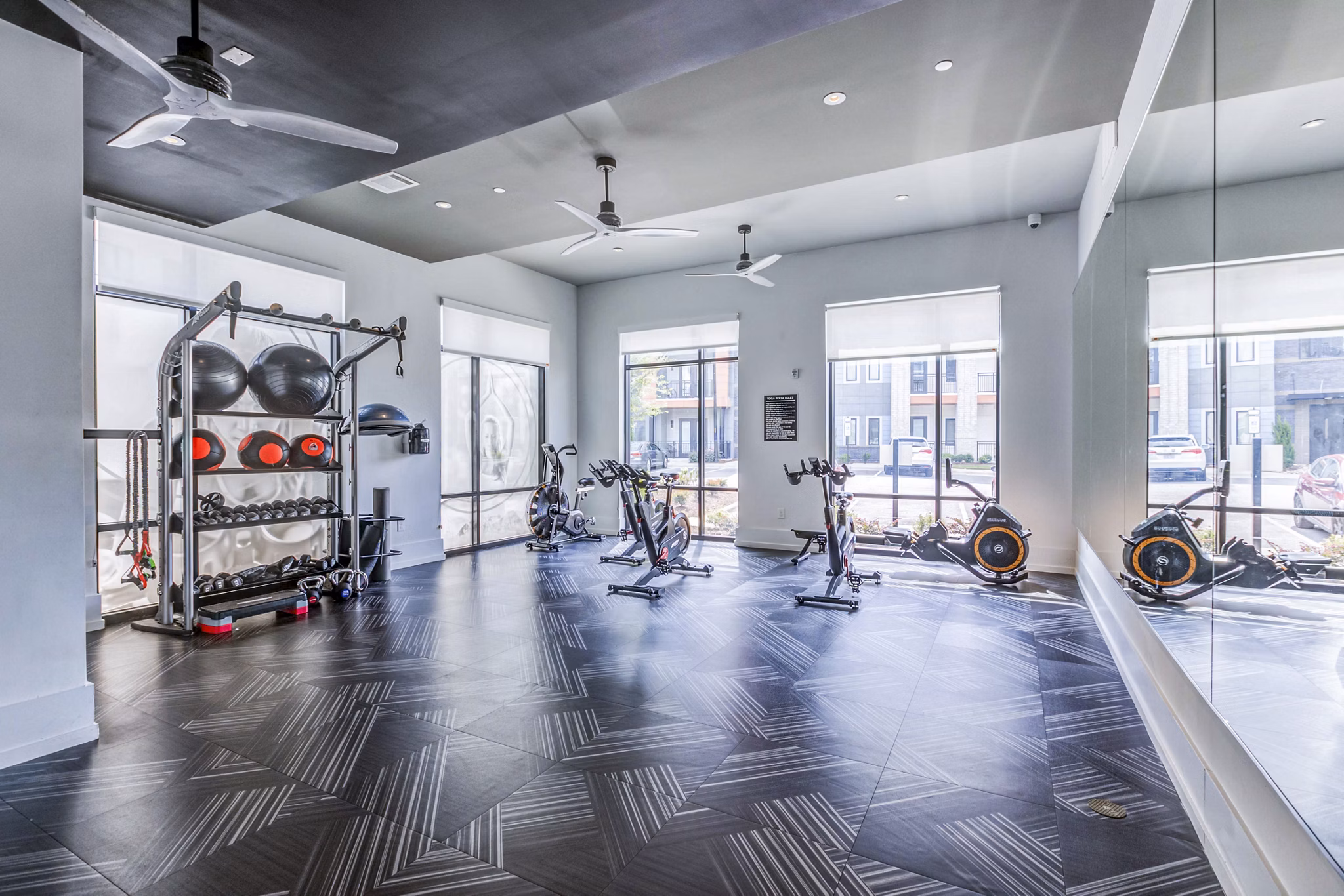 Fitness center featuring state-of-the-art equipment at Candour House Apartments, offering luxury living with wellness amenities