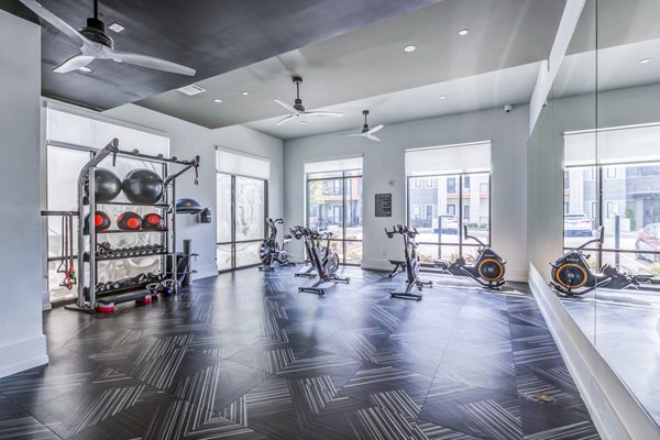 Fitness center featuring state-of-the-art equipment at Candour House Apartments, offering luxury living with wellness amenities