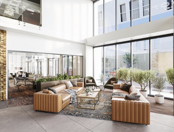 Clubhouse at The Walcott Hackensack: Modern social space with stylish seating and large windows in luxury apartments