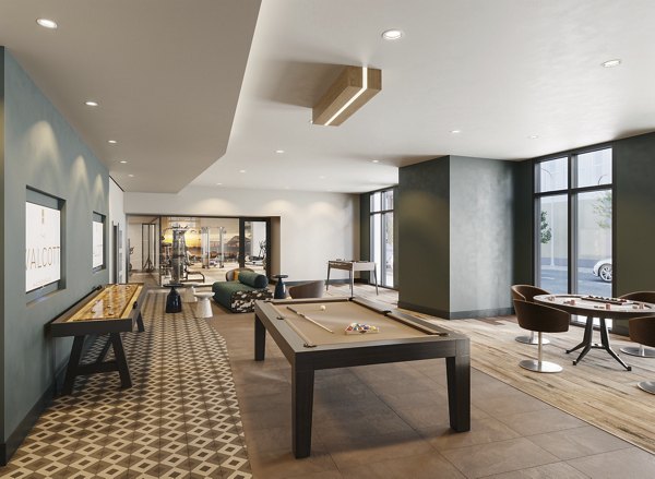 Game room with pool table and lounge seating at The Walcott Hackensack Apartments, offering a luxury entertainment space for residents