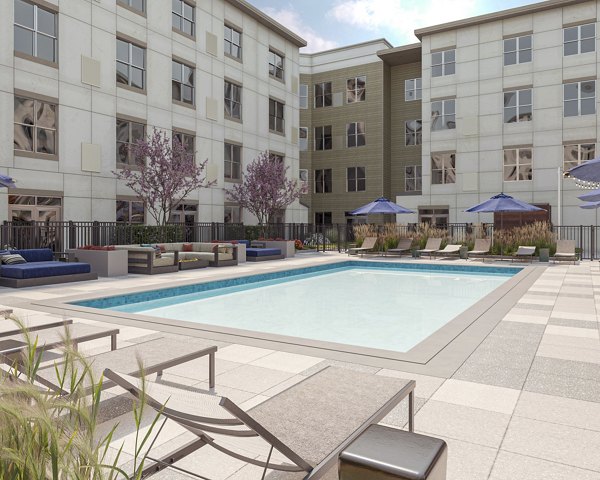 Elegant swimming pool with loungers at The Walcott Hackensack luxury apartments