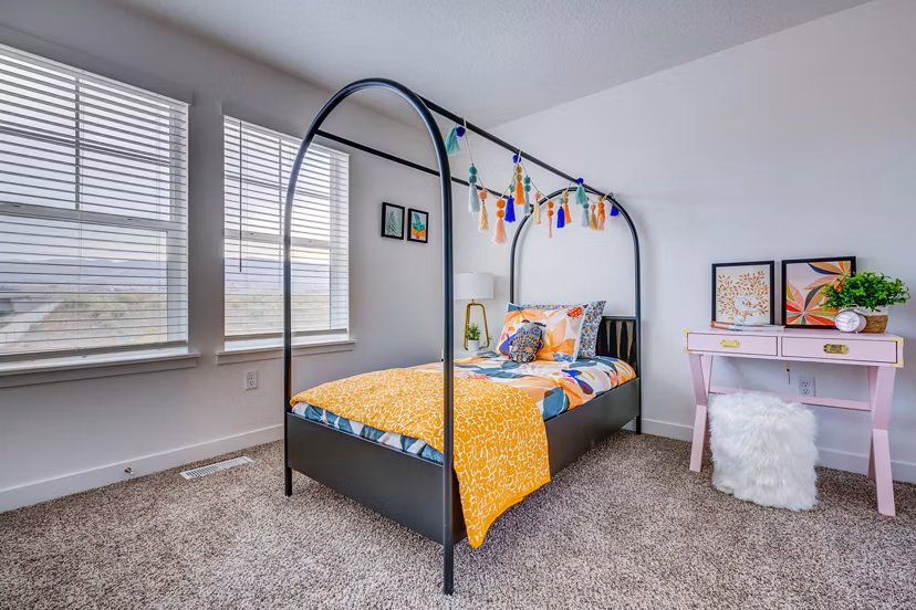 Elegant bedroom with king-size bed and contemporary decor at Jules on 3rd Apartments