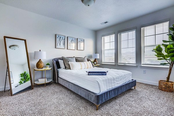 Bedroom with elegant modern design in Jules on 3rd Apartments